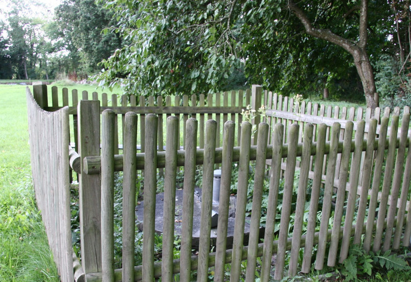 Fenced well to prevent drinking-water contamination.