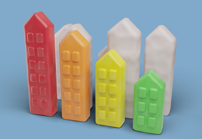 Stilisierte Miniaturhäuser in Rot, Orange, Gelb und Grün bilden eine Energieeffizienzskala.